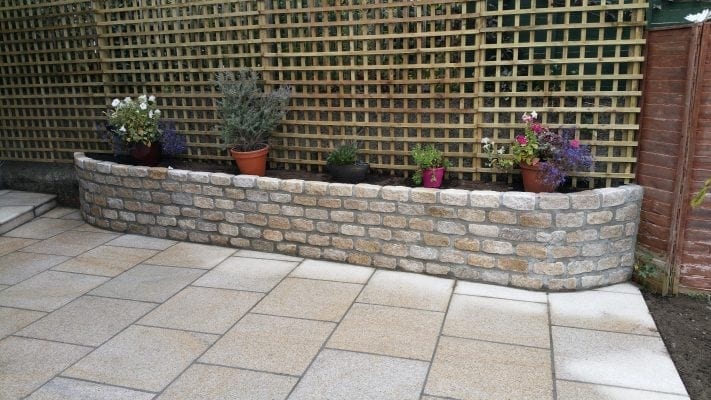 Brown Granite Patio with Raised Granite Flowerbed