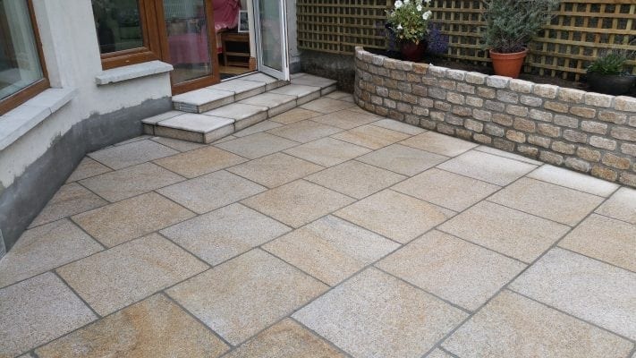 Brown Granite Patio with Raised Granite Flowerbed